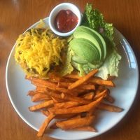 Quinoa Sweet Potato Kale Burger with Vegan Cheese and some Sweet Potato Fries! at Sweet Grass Grill in Tarrytown