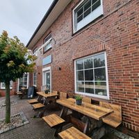 Front / outdoor seating at Farmers Fries in Busum