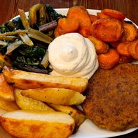 Burger with potatoes at ZEM Bistro in Bologna