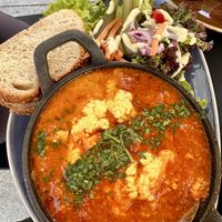 Breakfast egg dish made with tofu and grilled tomatoes  at Life Deli in Frankfurt