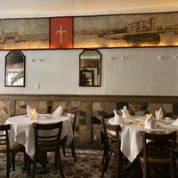 Inside; a scene from the Soprano's was filmed here.  at John's of 12th Street in New York City