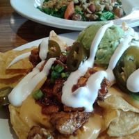 today's lunch: loaded nachos and Bombay curry bowl. So awesome at Veggie Grill by Next Level in Long Beach