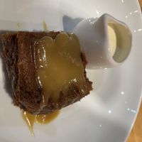 Date pudding with vegan cream  at Geshmak in Caerphilly