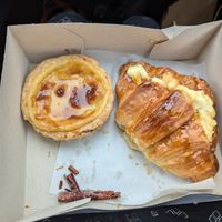 Nata tart and salted caramel croissant at A Padoca in Porto