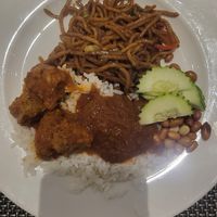 Fried noodles on top of the plate, nasi lemak on the bottom half at Berjaya Cafe 成功咖啡廳 in Kuala Lumpur