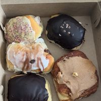 Mardi Gras with cream filing, chocolate glazed with Boston cream, Tiramisu, chocolate glazed, cinnamon roll at Breads on Oak  in New Orleans