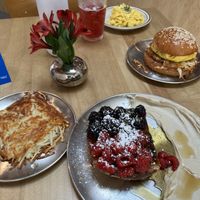 Our favorite restaurant 😍 100% vegan French toast, hash brown, scrambled Just egg, hibiscus tea, and two handed breakfast sandwich!  at Project Coffee - Rosemary in Sarasota