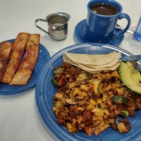 Soy bacon, vegetarian hash, and coffee with oat milk at Smile of the Beyond in Jamaica