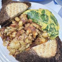 Vegan Popeye omelette “aumlette” with rye toast and homefries  at Smile of the Beyond in Jamaica