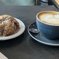 Soy latte and raspberry scone  at Herkimer Coffee in Seattle