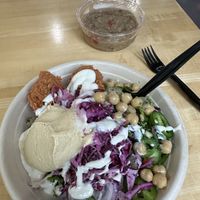 Walnut paste splatter with everything that we love in the vegan world of Arabic food.  side of baba ghanoush  at Nana Middle Eastern Street Food in Tampa