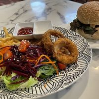 Vegan veggie burger (149 baht) with French fries, onion rings and salad (99 baht).  at May Veggie Home Express - ประสานมิตรพลาซ่า in Bangkok