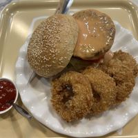 Homemade veggie burger with onion rings   at May Veggie Home Express - ประสานมิตรพลาซ่า in Bangkok