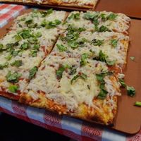 Individual vegan cheese pizza with basil at Tampa Pizza Company in Tampa