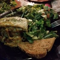 Half eaten lasagna (would be vegan without the cheese, which you could ask for) at Sativa Studio Cafe in Banos