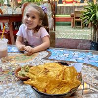 Patacones with guacamole   at Sativa Studio Cafe in Banos