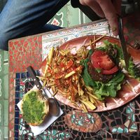 Burger and fries  at Sativa Studio Cafe in Banos