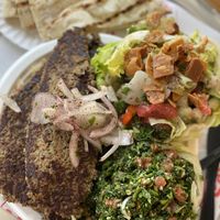 Impossible meat with rice, two sides, flatbread, and tahini sauce. It was enough for 3 meals. The meat was heavily seasoned and delish  at Furnsaj in San Diego