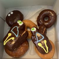 Voodoo doll, plain glaze, Apple fritter, Portland Cream, chocolate ring - all vegan  at Voodoo Doughnut in Portland