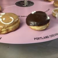 Rotating tray of vegan donuts  at Voodoo Doughnut Tres in Eugene