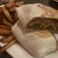 Vegan wrap with fries  at The Wren in Toronto