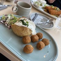 Ofenkartoffel mit veganer Kräutercreme und Falaffel €8,40  at Restaurant Nordlicht in Kaltenkirchen