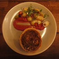 Vegetable Tagine Tart with sautéed potatoes, olives and spinach at Coach & Four in Wilmslow