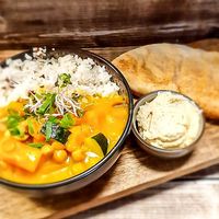Special pumpkin curry with pumpkin, chickpeas, zucchini, mushrooms, onion, yellow curry and coconut milk served with basmati rice at Sprakel in Enschede