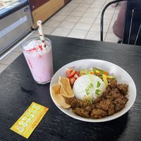 Rendang bowl and strawberry milkshake (chefs kiss)  at Loving Hut Perth in Wembley
