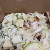 Potato salad on the left and slaw with apple and walnuts on the right  at Mandala VGF in Wynnum