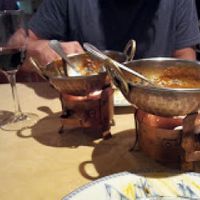 Food is served in these typical copper pots to keep it warm. at Taj Mahal in Santander