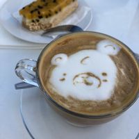 Cappuccino with soya milk and a dessert  at La Compañía in Santiago