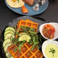 Savory waffles & English breakfast platter at Café Naiv in Innsbruck