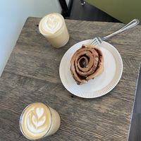 Cinnamon bun and lattes with oat milk   at Feast & Fallow in Vancouver