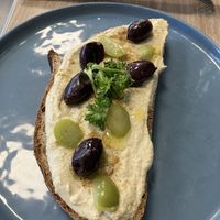 Olive and hummus toast   at Feast & Fallow in Vancouver