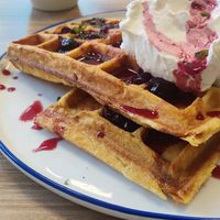 Waffles with cream, cherry compote and mint. at Feast & Fallow in Vancouver