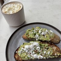 Latte with 🥑 toast   at Almond & Oat Coffee House in Las Vegas