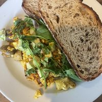 Scrambled tofu with tomatoes and mushrooms   at Kawa Cafe in Surry Hills