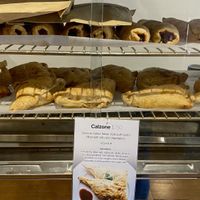 Vegan sausage rolls on top and vegan calzone below  at Krishna Food in Christchurch