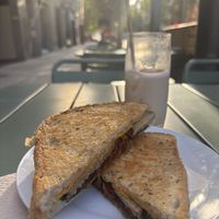Vegan sandwich (seitan, “cheese”, sundried 🍅, pickles, sth else) quite good and large portion ~7€ + iced chai latte with oat milk. Total 10€  at Híbrid Cafè Restaurant in Esplugues De Llobregat