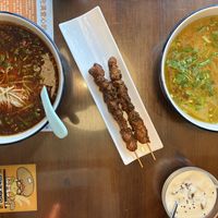 Dan Dan noodles (left), vegan skewers, Beijing noodle soup (right), vegan yogurt (bottom)  at Baiyi Vegetables Lanzhou Sulamian - 百易素食·素拉面（元大都店) in Beijing