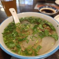 Plain noodles with some soya chunks, cilantro, and turnip at Baiyi Vegetables Lanzhou Sulamian - 百易素食·素拉面（元大都店) in Beijing