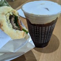 Vegan breakfast sandwich and Coraline's coconut cream cold brew. at Stumptown Coffee Roasters - Downtown in Portland