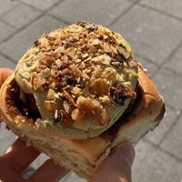 Nut Roll - Topped with pistachio frosting and caramelized sliced almonds.  at Have A Roll in Brussels