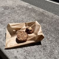 Oat/seed “muffin” and peanut butter chocolate bite.  at Syra Coffee in Barcelona