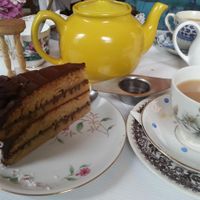 Vegan chocolate and coconut cake with tea in the secret tearoom at Norman's Coach and Horses in London