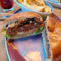 "Naturbursche" burger with caramelized onions & mushrooms, and regular fries ("Goldfritten") at Hans im Glück in Fulda