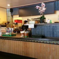 Front counter with free Buddha posters and CDs at Veggie Today in Concord