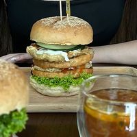 Double chicken burger with double fried vegan eggs  at nomVnom Cafe in Johor Bahru