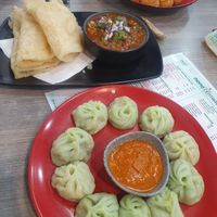 Steamed momos, soft naan and pea curry, deep fried momos at Momo Central - Bourke St in Melbourne